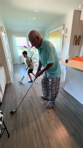 Dad Demonstrates Golf Swing Technique