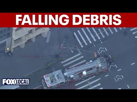 Debris falls from building in Lower Manhattan