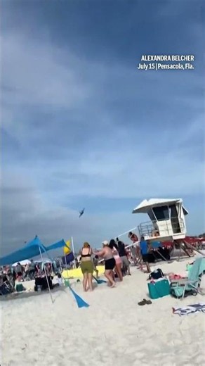 U.S. Navy fighter jet flies low over Florida beach