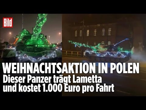 LICHTERKETTE STATT TARNNETZ: Weihnachts-Panzer rollt durch polnische Stadt