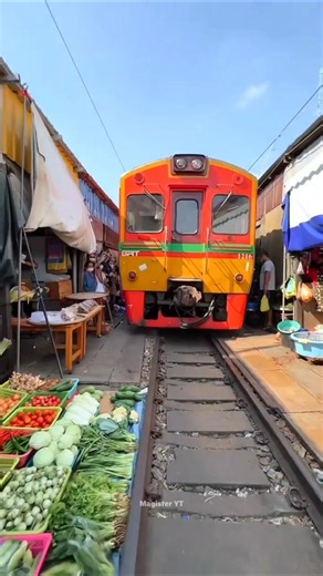 The Amazing Market Where Trains Pass Inches Away!