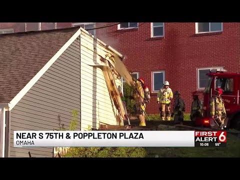 Crews battle fire that spread to several Omaha garages