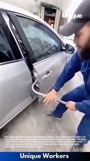 Car Door Repair: Worker Uses Lever Tool to Bend Damaged Door Back into Shape