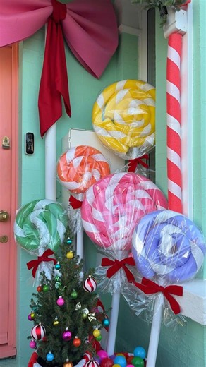 DIY Giant Lollipop Decorations | Diy large christmas candy decorations, How to make lollipop decorations, Candy house front porch