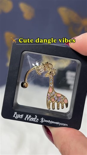Bodyjewelry.com on Instagram: "Playful, unique, and impossible to miss 🦒✨ This long dangle giraffe belly button ring adds fun movement and personality to your look. The elongated drop design creates eye-catching sway with every step — perfect for anyone who loves standout, cute-but-bold jewelry. #BellyButtonRing #DangleJewelry #AnimalJewelry #BodyJewelry #fyp"