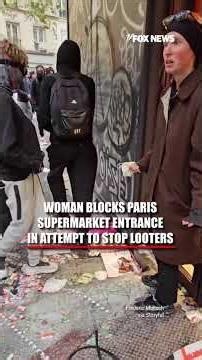 Woman blocks Paris supermarket entrance in attempt to stop looters #shorts