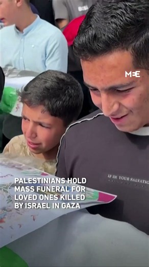 Palestinians hold mass funeral for killed loved ones in Gaza