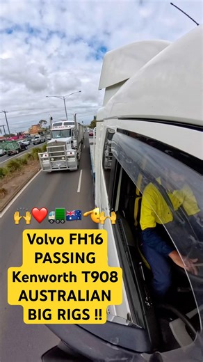 Volvo FH16 Flatbed Passes Kenworth T908 A-Double Long Vehicle At Traffic Lights. Big Rigs Australia