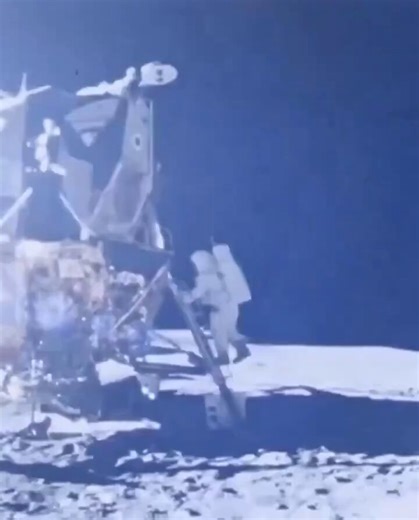 Historic moment when Neil Armstrong and Buzz Aldrin planted the flag on the Moon on July 20, 1969 (Apollo 11)