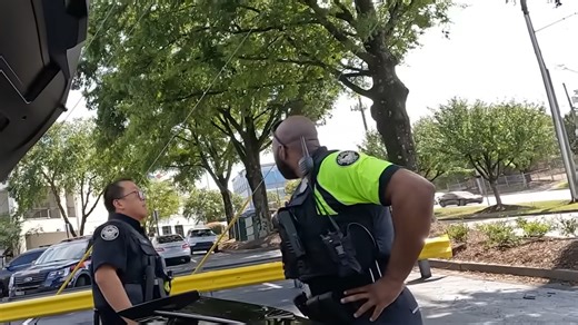 I'll sue if you tow it! - Towtrucker watches as officer refuses to back down