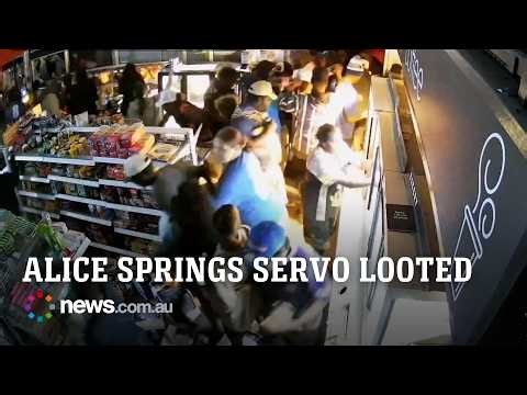 Footage shows crowds rushing Alice Springs service station