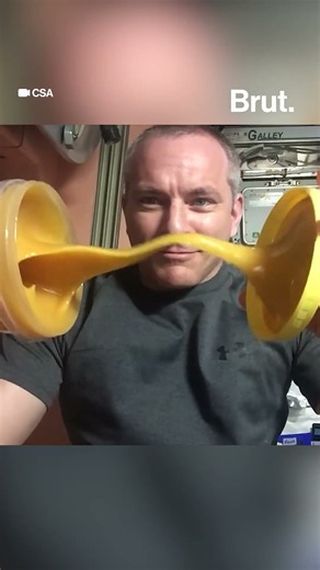 Astronaut demonstrates the behavior of honey in space.