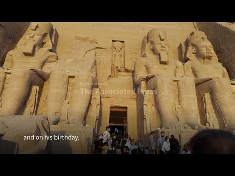 Rare illumination of Ramesses II statue in Abu Simbel at sunrise