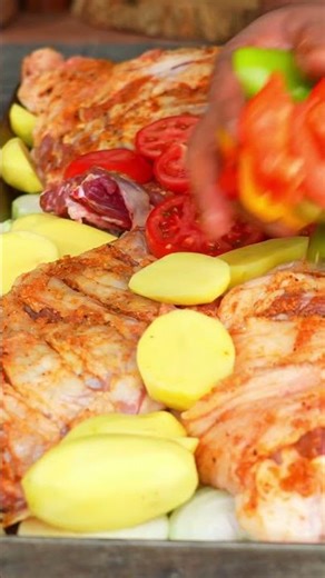 Rustic Outdoor Oven Feast: Grilled Meat and Vegetable Medley