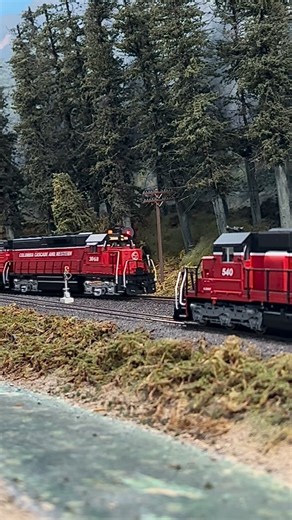 “Mountain Goat” Greg Baker on Instagram: "A trio of new GP units lead the trailer train uphill past a train in the siding a Granite Mountain. Filmed on the HO scale CC&W layout during our last operating sessions. #mountaingoatmodels #hoscale #modeltrainsofinstagram #tracksahead"
