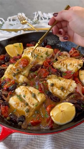 Baked Cod with Cherry Tomatoes, Olives and Capers in White Wine Sauce Ingredients: 4 Cod Filets (about 12 oz) 12 oz cherry/grape tomatoes 1/2 cup Greek medley olives 1/2 red onion 2 tablespoons capers, rinsed 1/4 cup olive oil 3 garlic cloves, crushed 1 tsp salt 1/2 tsp black pepper 1 tbs parsley 1/4 cup white wine 1/2 lemon Method: 1. Preheat oven at 450 F; 2. To a fish or casserole dish add tomatoes sliced red onion and garlic; season with olive oil, salt and pepper; mix well and roast for abo