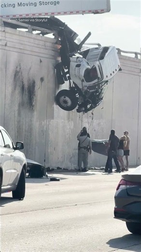 Man Jumps Out of Truck Left Hanging Over Highway After Crash