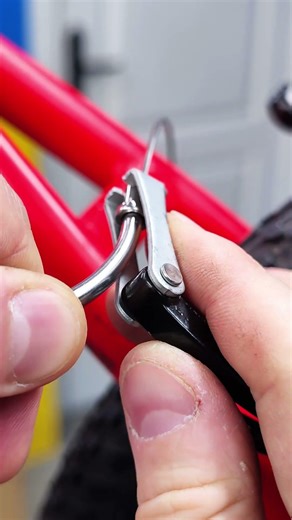 Installing the brake cable into the V-Brake lever of your bike.