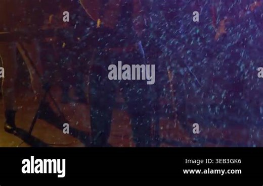 spray initiating rain as singer stepping forward raising mic stand singing music alongside band. Performance, concert, stage, lighting, music, vocals, rhythm Stock Video Footage - Alamy