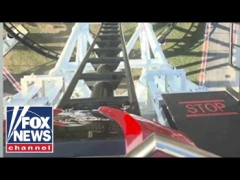 Riders left DANGLING after roller coaster STALLS