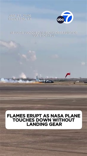 A NASA research aircraft made a gear-up landing in Houston after experiencing a mechanical issue, according to a spokesperson. Footage captured by Nevada Vazquez shows the plane slowly descending toward the runway before touching down with a jolt, flames erupting and sending a trail of smoke billowing behind the aircraft. | ABC7
