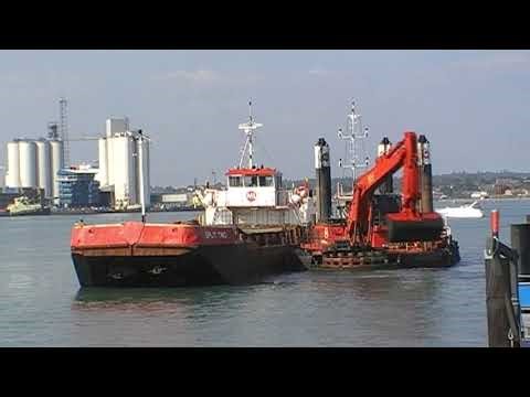SPLIT TWO Loading dredged mud at Hythe Marina