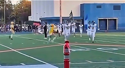 High School Football Star Carrying American Flag Onto Field Gets Viciously Attacked By Opposing Player [VIDEO]