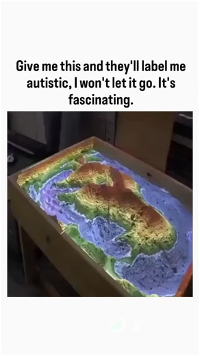 Explainer_Zone on Instagram: "The post features a 33-second video of an Augmented Reality Sandbox, where users shape sand to instantly generate projected 3D topographic maps, water flow simulations, and erosion visuals, prompting the author to humorously admit they'd obsess over it despite social stigma. Invented in 2012 at UC Davis, this open-source tool revolutionizes geoscience education by enabling hands-on exploration of landforms; a 2022 Geosphere study confirms it boosts students' spatial