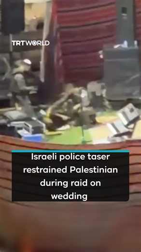 Video from Israeli raid on Palestinian wedding shows Israeli police tasering restrained man