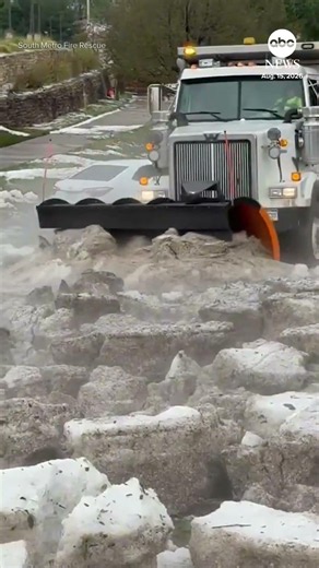 Snowplow clears road after hailstorm in Colorado