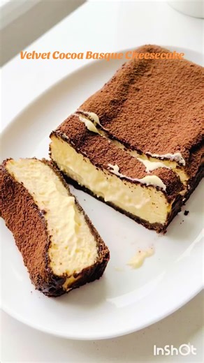 The Ultimate Jiggle: Burnt Basque Cheesecake Creamy, soft, and perfectly jiggly! ✨ Our signature Burnt Basque Cheesecake, finished with a fine dusting of cocoa powder. Pure bliss in every bite. 🍰 #BasqueCheesecake #FoodPhotography #GlossyFood #SatisfyingEats #CheesecakeLovers