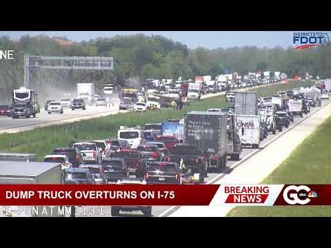 Dump truck overturns, spills gravel onto southbound lanes of I-75 near Immokalee Road
