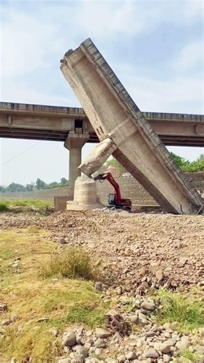 Controlled demolition of old concrete bridge girder