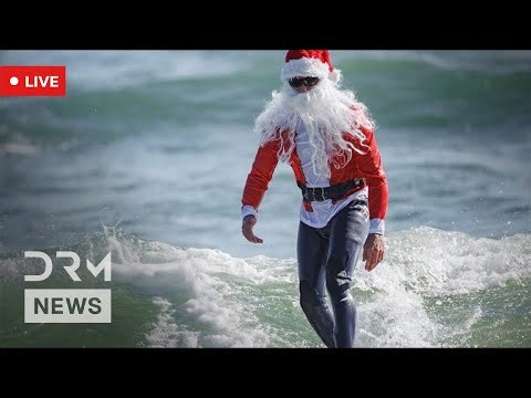 LIVE From Florida: Santas Swap Sleighs for Surfboards at Cocoa Beach Surfing Santas Celebration