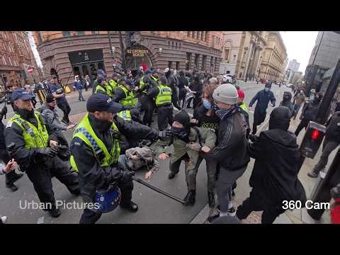 Police PUNCH protesters: Manchester erupts into violence as Britain First met by counter-protest