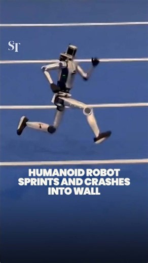 Humanoid robot crashes into a wall during a sprint test at the 'Robot Olympics' in Beijing