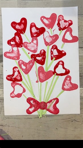 Heart Bubble Bouquet! 💐 💕 This is such a cute and fun craft for Valentine’s Day. You can use paper strips or marker pen for your flower stems. You can also put them on before or after your bubble flowers. Whatever gives you the effect you prefer! 🤩❤️ #crafting #craft #craftideas #crafts #preschoolactivities | Home is Where the Art is