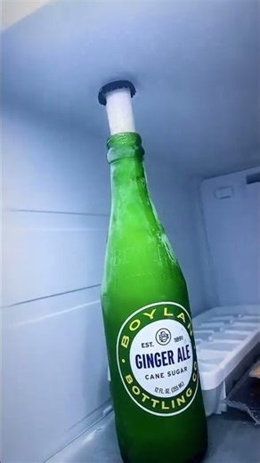 Frozen Ginger Ale Erupts from Bottle with Cap Still On