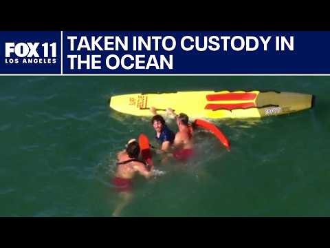Pursuit suspect attempts to swim away from authorities