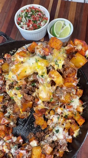 Fiesta Taco Potato Skillet is an easy weeknight dinner my family loves! INGREDIENTS 5 small/medium potatoes olive oil salt, pepper, garlic powder, and paprika (for potatoes) 1 lb ground beef 1/2 tsp salt and pepper 1/4 tsp cayenne 2 tsp chili powder 1 tsp each of cumin, paprika, and dried cilantro 1 tbsp minced garlic Shredded cheddar cheese 1 1/2 cups white Queso Sour cream Cilantro INSTRUCTIONS Peel, wash potatoes, and cut up into cubes. Toss with olive oil, salt, pepper, garlic powder, and pa