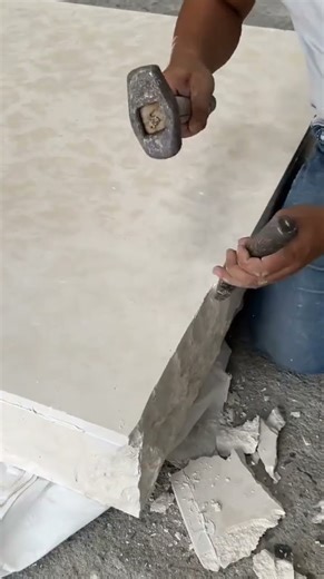 Carving a stone manually using simple carving tools is done carefully