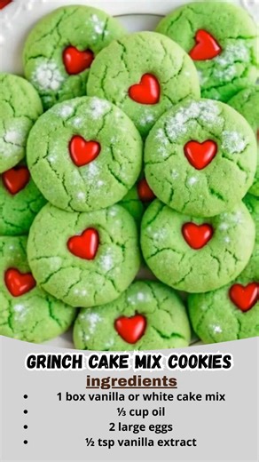 Grinch Cake Mix Cookies | Soft, Chewy & Filled With Holiday Cheer 💚❤️ These cute little green cookies always make me smile — soft, crackly, and topped with a sweet red candy heart. They’re so easy to whip up, and kids absolutely LOVE them. Perfect for holiday movie nights or cookie trays! Ingredients 1 box vanilla or white cake mix ⅓ cup oil 2 large eggs ½ tsp vanilla extract Green gel food coloring ½ cup powdered sugar (for rolling) Red candy hearts or red chocolate candies for topping Instruc