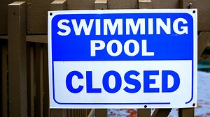 Why are many neighborhood pools still closed?