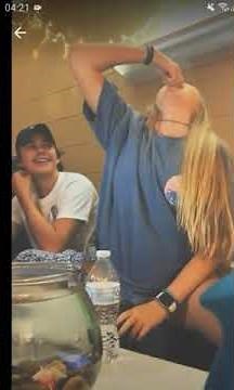 Cute girl swallows live fish