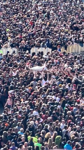 Jesus crowd surfing for our sins during Alice Cooper