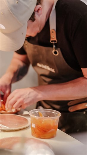 The Deli Social on Instagram: "The magic of The Deli Social begins long before the room fills. In the quiet before service — hands moving quietly, aprons tied, knives meeting boards as the room slowly finding its hum. Nothing hurried. Nothing accidental. Just the steady rhythm of preparation, so that when service begins, it all feels easy. What you see at the table is only the surface. The rest lives in these moments before."