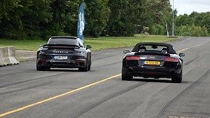 Who wins this acceleration run between Audi R8 and Porsche 911?