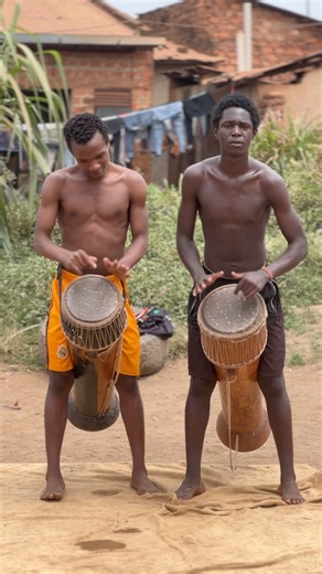 Drumming simple rhythm on engalabi/djembe