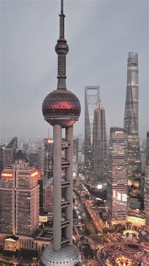 Oriental Pearl Tower. The tower is a distinctive landmark in the Lujiazui financial district of Shanghai, China. Completed in 1994, it features 11 steel spheres of various sizes and was the tallest structure in China until 2007. It offers panoramic views of the city from multiple observation decks. Other prominent skyscrapers visible include the Shanghai Tower and the Shanghai World Financial Center. #trending #fyp #theritikroshantajne0407 #theritikroshantajne0408 #china🇨🇳 | Ritik Roshan Tajne