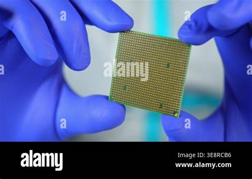 Scientists and engineer shows CPU Central Processing Unit in the hand. Concept of AI boom triggered a massive shortage of CPUs, driving prices high as tech giants hoard components for data centers Stock Video Footage - Alamy